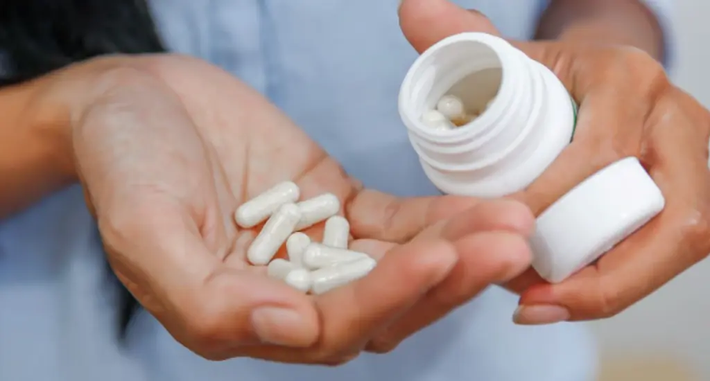 Person exploring medication-free options for joint pain relief