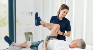 Physical therapist helping a patient with rehabilitation exercises
