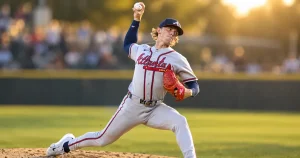 Baseball pitcher mid throw with the throwing elbow in focus