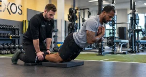 Soccer player doing Nordic hamstring curls to reduce hamstring strain risk