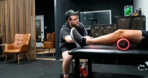 Physical therapist guiding an athlete through ACL prehab exercises in Cherry Hill, NJ